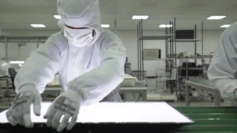 Laboratory workers assemble and test TVs on a conveyor belt in the laboratory Stock Footage 233034866