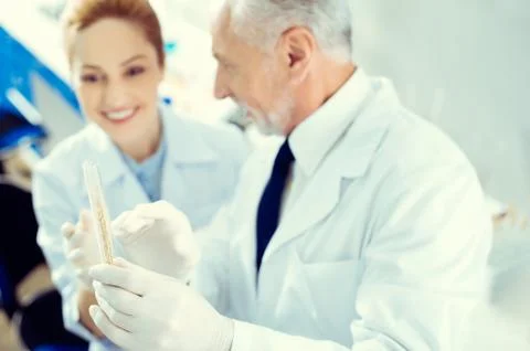 Laboratory workers discussing test sample in lab 스톡 사진