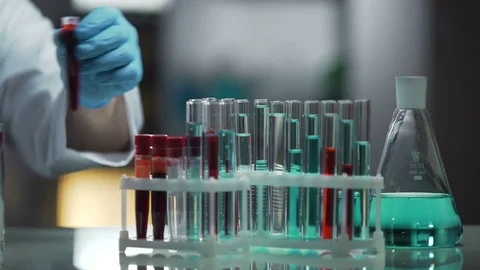 Laboratory working surface occupied by test tubes and flasks, research process Stock Footage 73956713