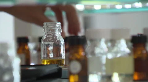 In the laboratoy_a sample is put into flacon Stock Footage 57815187