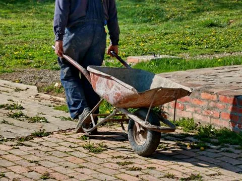 Laborer  are using a trolley to move the mortar Stock Photos