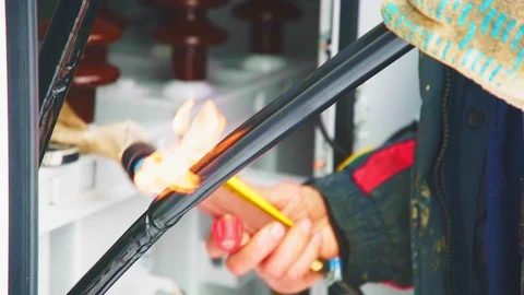 Laborer covers electrical cable with insulation with burner Video stock 127755028