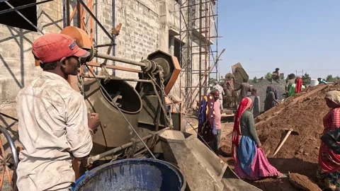 Laborer Operating Concrete Mixer Machine at Building Development Project Stock Footage 343910024