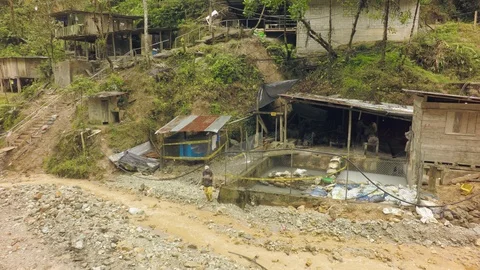 Laborer Walking Under The Rain In A Mining Village Video stock 94736646