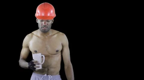 Laborer at work - taking a break removing hard hat and drink Stock Footage