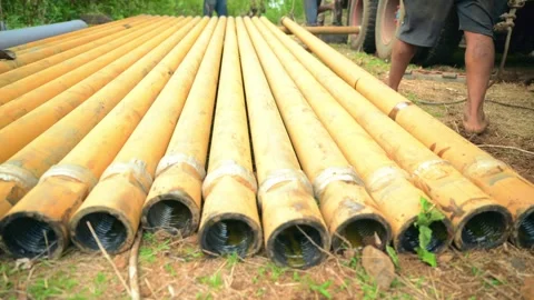 Laborers Adjust Rig Using Rope on Open Ground Stock Footage 304852594
