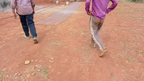 Laborers Head Toward Chain Link Mesh on Ground Video stock 311628646