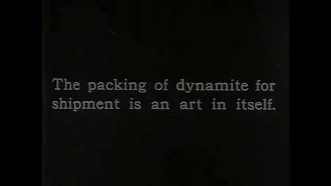 Laborers load and pack a shipment of dynamite in the 1920s. Stock Footage 139642560