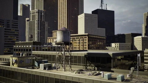 Laborers on rooftop perform inspection next to water tower at sunset Stock Footage 341829066