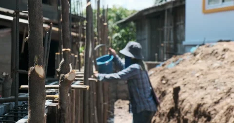Labour group working on cement wall and ground beam building brick wall Stock Footage 164587018