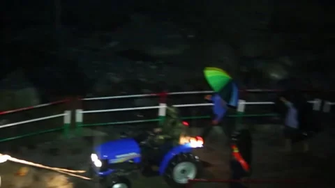 Labour Pulling tractor on demolished Route Stock Footage 145539680