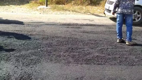 A labour worker is busy in making the road. Stock Footage 143328325