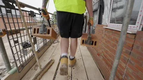 Labourer Carries Bricks On Building Site 스톡 동영상 239756482