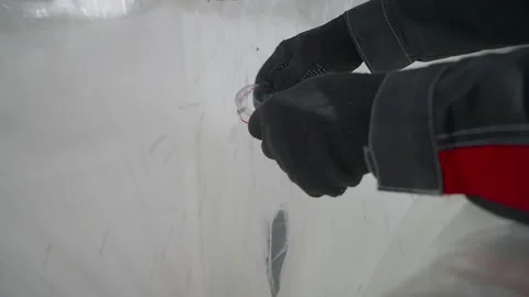 Labourer puts a little plastic bag under a pipe distributing recycled pellets Vídeo Stock 277303857