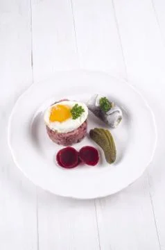 Labskaus with fried egg on a plate Stock Photos