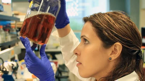 Labtech checking media Stock Footage 880187