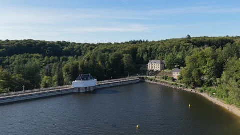 The Lac des Settons dam in Morvan, France, showing the lake, the dam structure Stock Footage 346714199