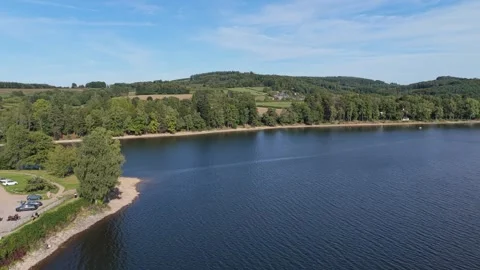 Lac des Settons in the Morvan region of France, showcasing the tranquil blue Stock Footage 346707846