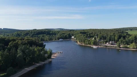 Lac des Settons, a scenic lake surrounded by lush green forests in the Morvan Stock Footage 346713357