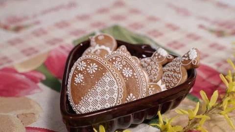Lace-Iced Easter Gingerbread Cookies in Heart-Shaped Bowl Stock Footage 306143430