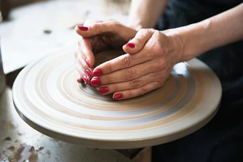 A lace maker and ceramicist create artwork Stock Photos