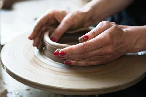 A lace maker and ceramicist create artwork Stock Photos