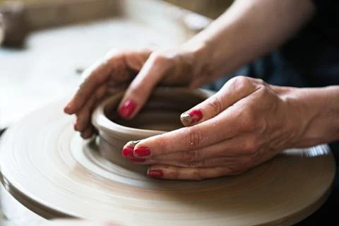 A lace maker and ceramicist create artwork Stock Photos