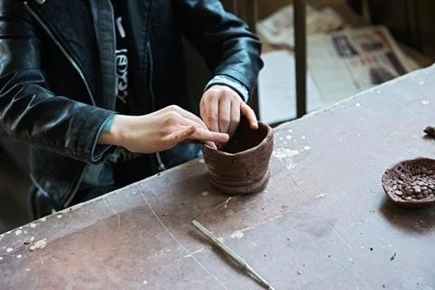 A lace maker and ceramicist create artwork Stock Photos