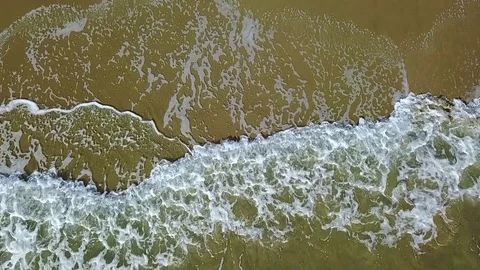 Lace pattern on the sand leave by waves. Aerial survey. Slow motion Stock Footage 82237892