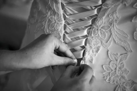 Lacing the bride Stock Photos
