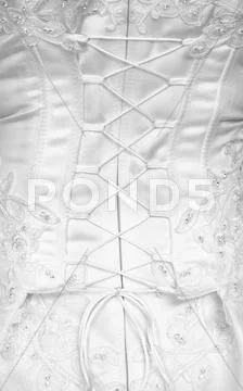Lacing on a corset - rear view Stock Photos