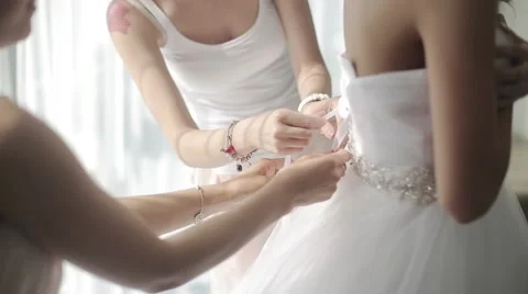 Lacing of a Wedding Dress Stock Footage 49999776