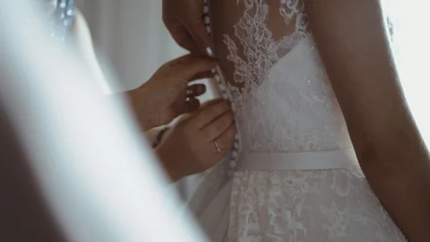 Lacing wedding dress. Stock Footage 93320747