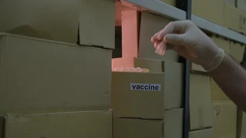 Lack of coronavirus vaccine in boxes Stock Footage 148077128