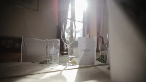 Laconic, minimalist table setting. Empty glasses and white plates on the Stock Footage 204123890