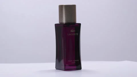 Lacoste Elixir. Perfume bottle rotation in studio Vidéo 171763218