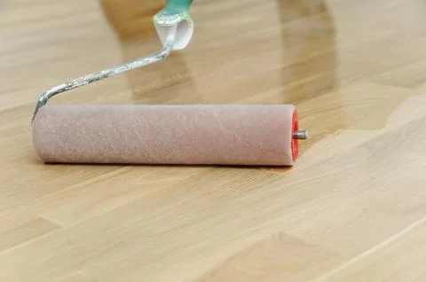 Lacquering wood floors. Stock Photos