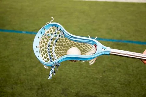 Lacrosse stick carrying a ball Stock Photos
