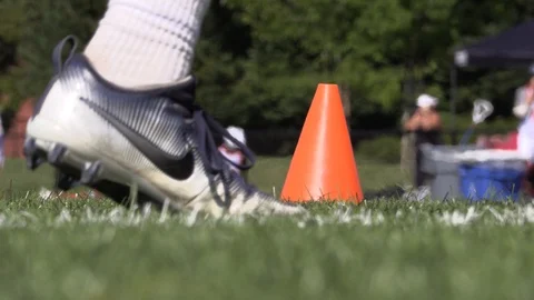 Lacrosse Training Break Ground Level with cone and bokeh in the back ground Stock Footage 127610806
