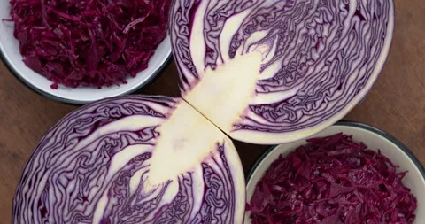 Lacto-fermented red cabbage and halved raw cabbage. Stock Footage 278411154