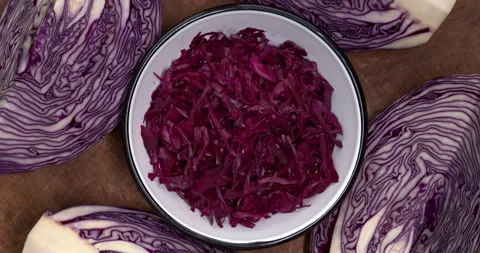 Lacto-fermented red cabbage salad and quarters of fresh cabbage. Stock Footage 278235078