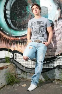 Lad in torn jeans Stock Photos