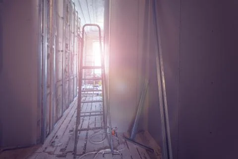 Ladder and construction tools and interior of room during of installing of Stock Photos