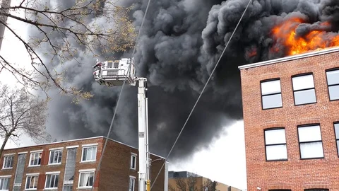 Ladder erecting during structure fire in the city Stock Footage 114946217