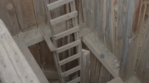 Ladder Going Down into Abandoned Mine Shaft - Shallow Depth of Field Stock Footage 140475727