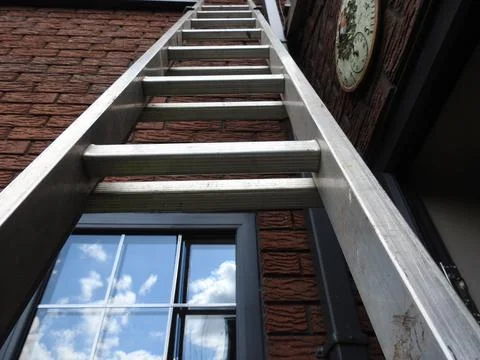 Ladder going up the wall Stock Photos