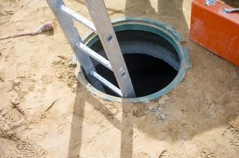 Ladder inside a manhole Foto stock