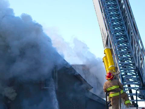 Ladder truck with firefighter Stock Photos