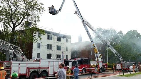 Ladders, firetruck and building on fire Stock Footage 114802431