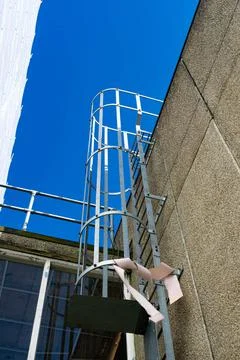 Ladders on the side of a building Stock Photos